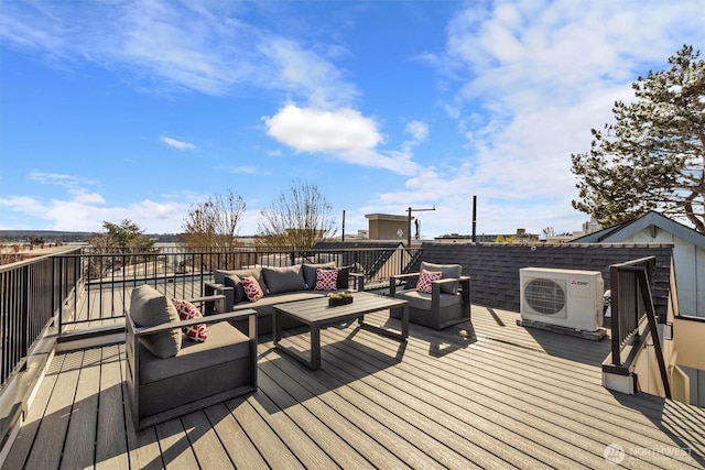 wooden deck featuring an outdoor living space and ac unit