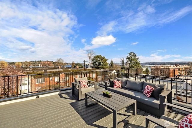 wooden terrace featuring an outdoor living space