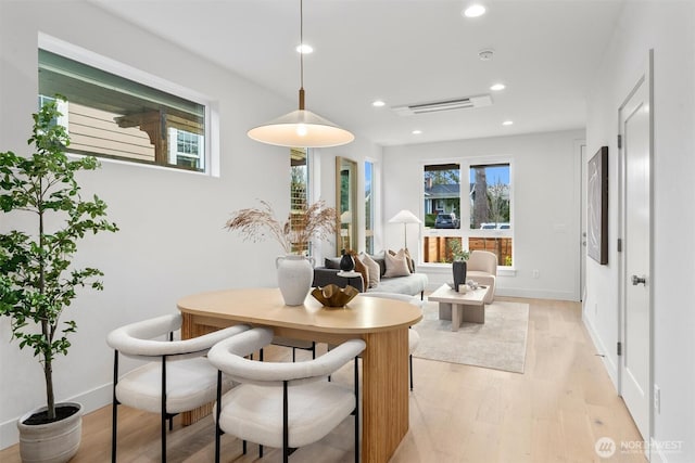 dining space with recessed lighting, visible vents, baseboards, and light wood-style flooring