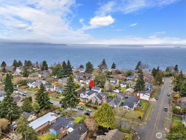 birds eye view of property with a residential view and a water view