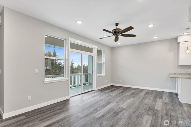 unfurnished living room with recessed lighting, ceiling fan, baseboards, and wood finished floors