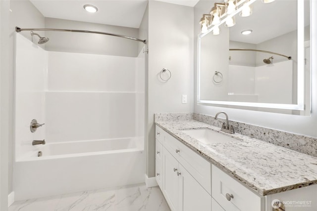 bathroom featuring bathtub / shower combination, vanity, and marble finish floor