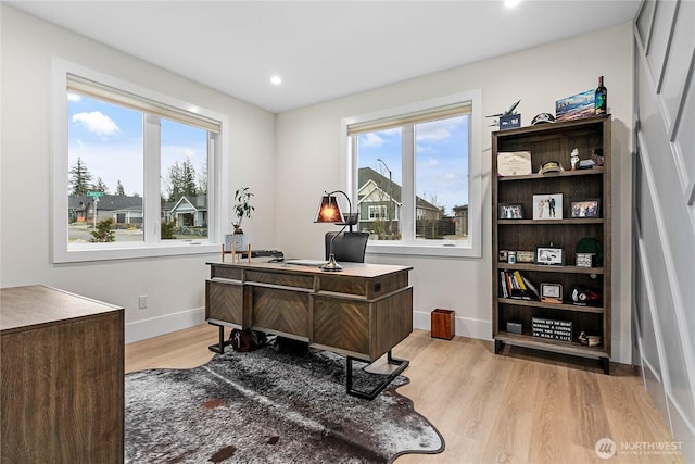 office area featuring recessed lighting, baseboards, and light wood-type flooring