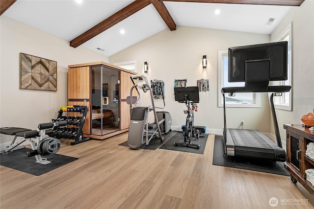 workout area with visible vents, light wood-style flooring, recessed lighting, baseboards, and lofted ceiling