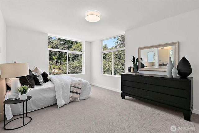 bedroom featuring baseboards and carpet floors