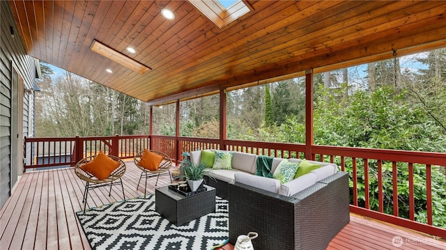 wooden terrace with outdoor lounge area