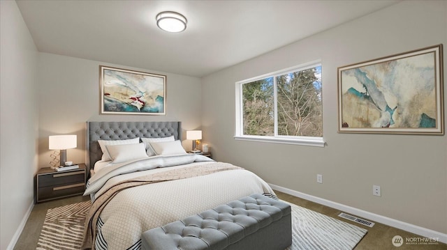 bedroom featuring carpet flooring, baseboards, and visible vents