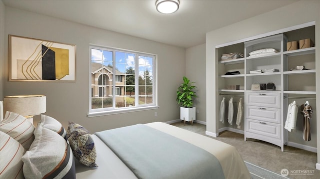 carpeted bedroom featuring a closet and baseboards