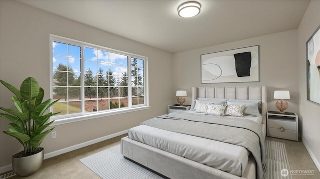 bedroom with visible vents, baseboards, and carpet floors