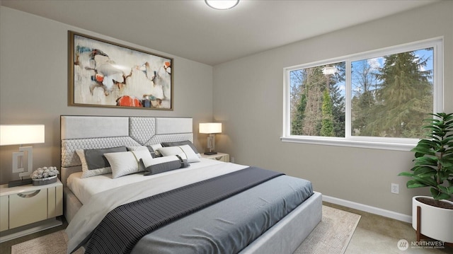 bedroom featuring baseboards and carpet