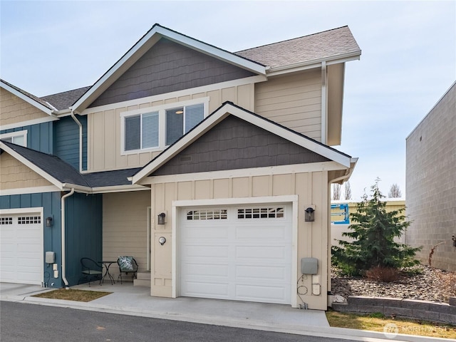 view of front of house with board and batten siding, a shingled roof, and a garage