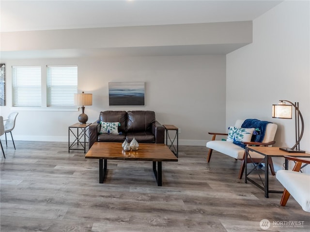 living room with wood finished floors and baseboards