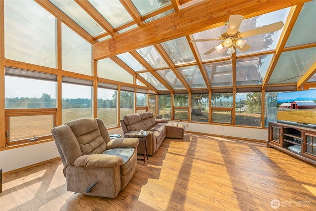 4596 Woodcock Rd, Sequim, WA 98382 - living area featuring light wood finished floors, ceiling fan, baseboards, and lofted ceiling with skylight