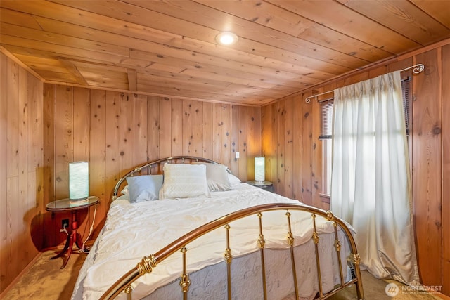 4596 Woodcock Rd, Sequim, WA 98382 - carpeted bedroom with wooden walls and wood ceiling