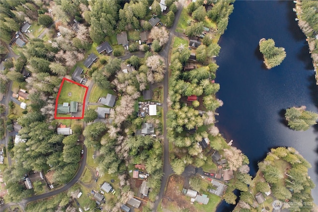 birds eye view of property featuring a water view