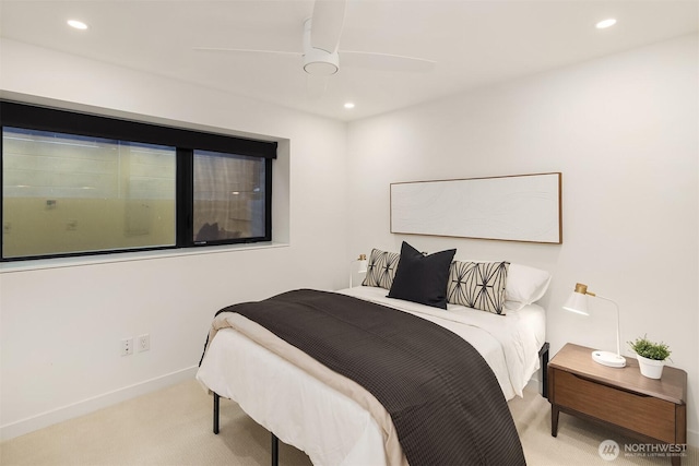 bedroom with a ceiling fan, recessed lighting, light colored carpet, and baseboards