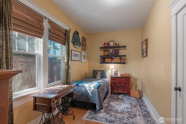 bedroom featuring wood finished floors