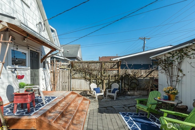 wooden deck featuring fence