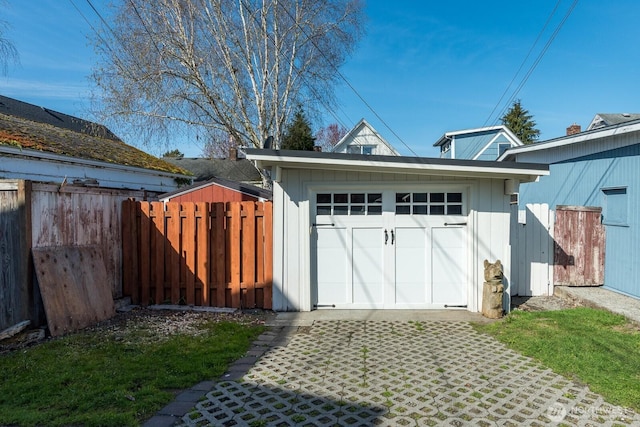 garage featuring fence