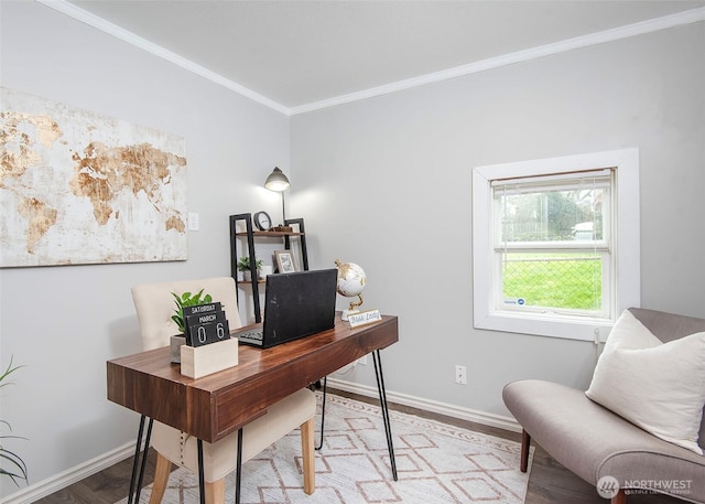 office space featuring crown molding, wood finished floors, and baseboards