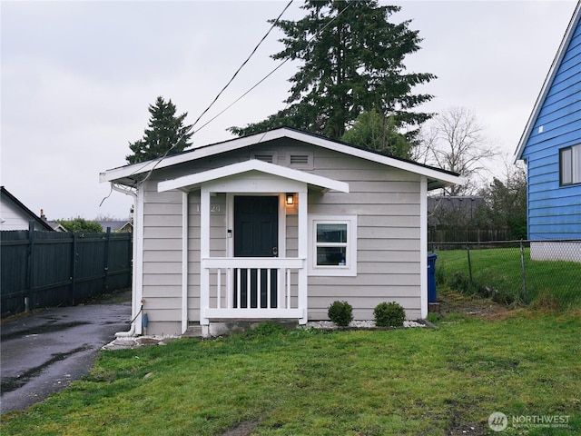 exterior space featuring an outdoor structure and fence