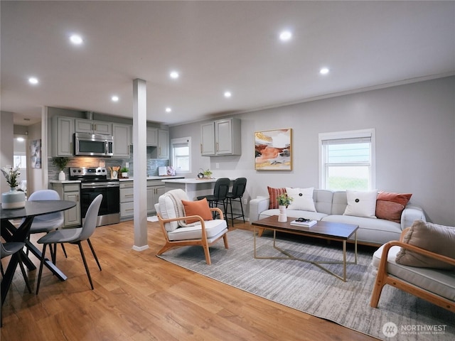 living room featuring recessed lighting and light wood-style floors