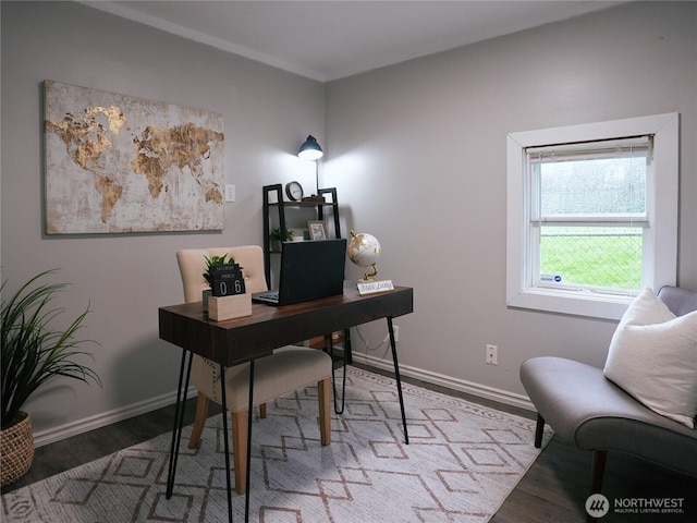 office featuring baseboards and wood finished floors