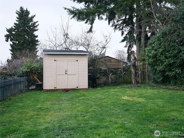 view of shed featuring a fenced backyard