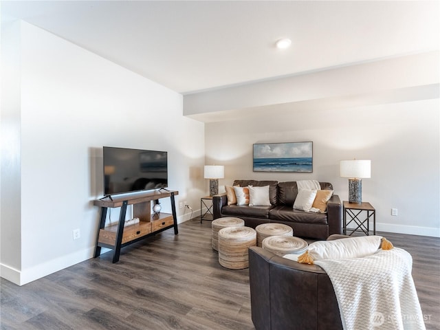 living room featuring dark wood finished floors and baseboards