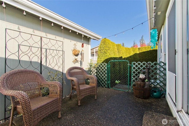 view of patio / terrace with fence and a gate