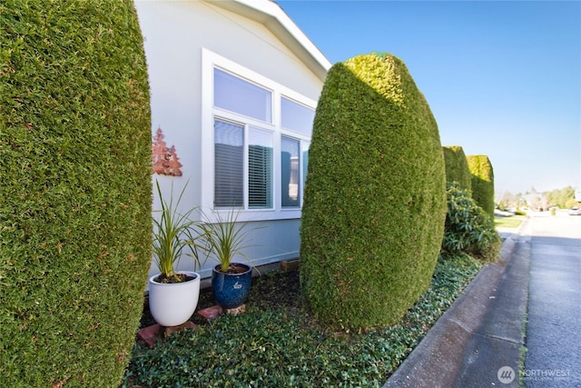 view of side of home featuring stucco siding