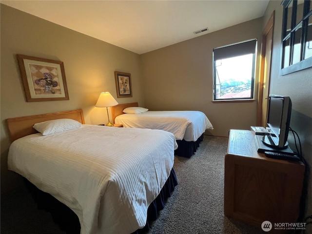 bedroom with carpet flooring and visible vents