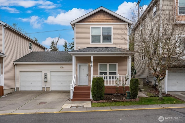 view of front of home with a garage, a porch, and driveway