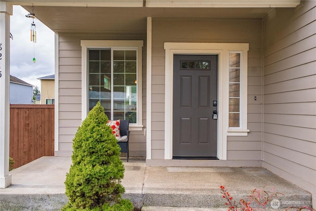 entrance to property featuring a porch