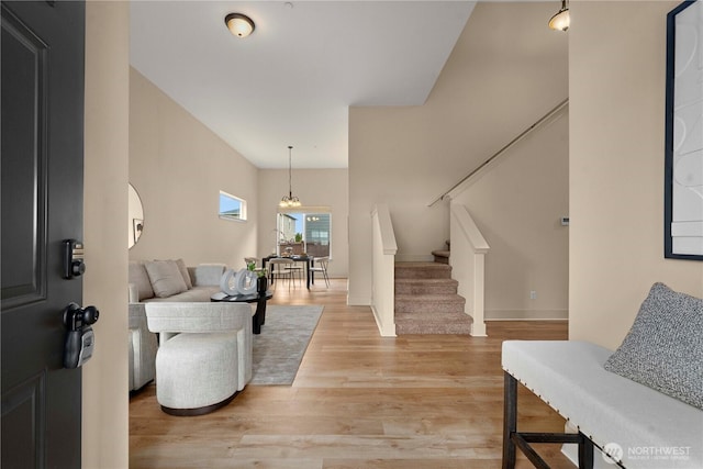 entryway featuring stairs and light wood finished floors