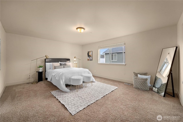 carpeted bedroom with baseboards