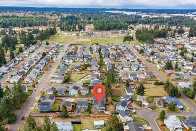 birds eye view of property with a residential view