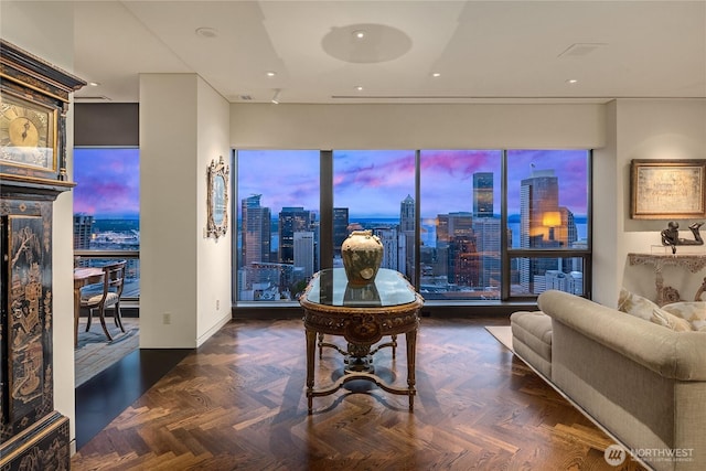 dining space with recessed lighting and a city view