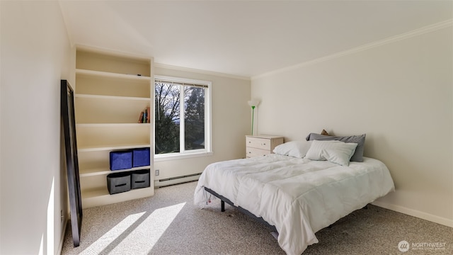 bedroom with a baseboard heating unit, baseboards, carpet, and crown molding