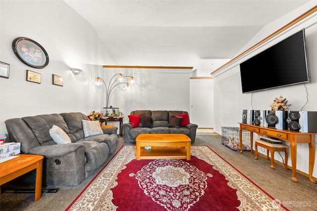 living area featuring carpet flooring and lofted ceiling