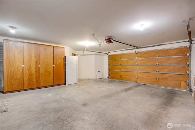 1200 Viewland Way, Edmonds, WA 98020 - garage with freestanding refrigerator and a garage door opener