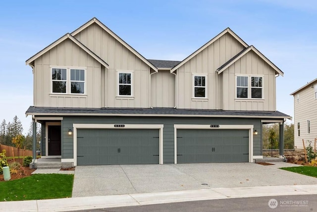 view of front of home with a garage, board and batten siding, concrete driveway, and a shingled roof