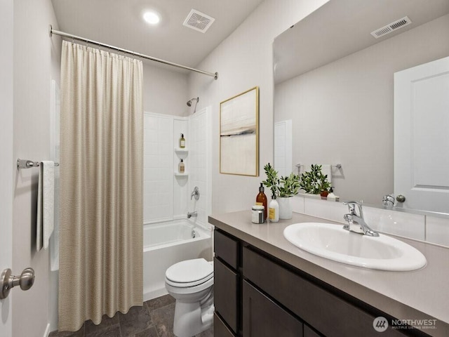 bathroom with visible vents, shower / tub combo, toilet, and vanity