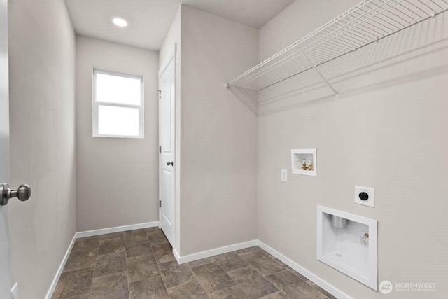 laundry area with stone finish flooring, baseboards, washer hookup, laundry area, and electric dryer hookup