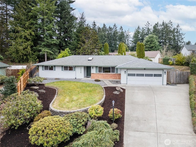 single story home with a front lawn, driveway, fence, an attached garage, and a shingled roof