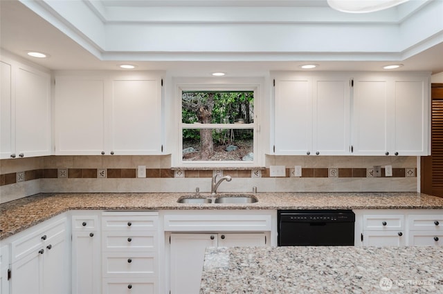 kitchen with white cabinetry, black dishwasher, and a sink