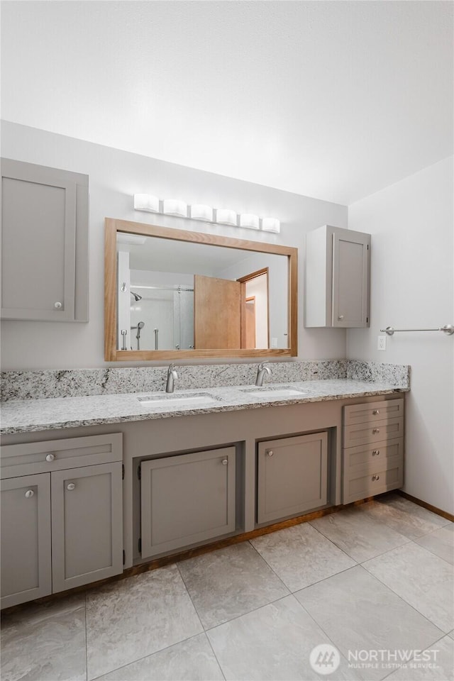 bathroom featuring double vanity and a sink