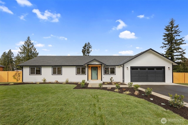 ranch-style home with a front lawn, an attached garage, fence, and driveway
