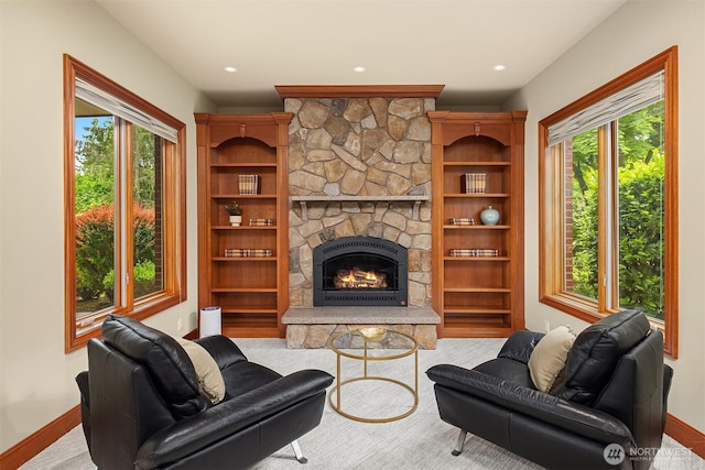 18212 244th Ave NE, Woodinville, WA 98077 - living area featuring baseboards, plenty of natural light, a stone fireplace, and recessed lighting