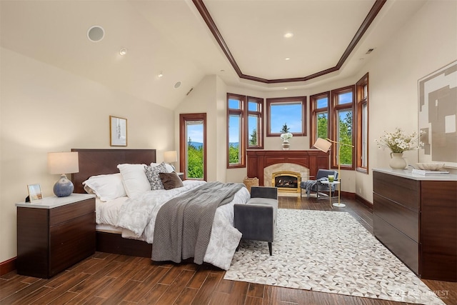 18212 244th Ave NE, Woodinville, WA 98077 - bedroom featuring dark wood-type flooring, a fireplace, baseboards, a tray ceiling, and ornamental molding